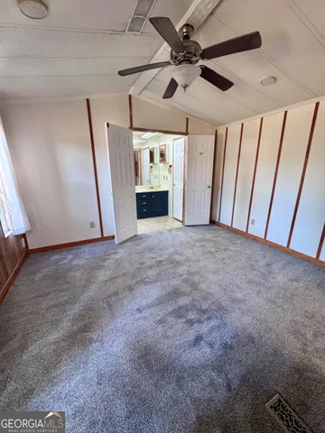 a bathroom with a sink toilet and mirror