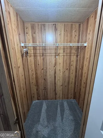 a view of building with car parked on the road