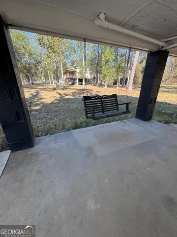 a view of a lake with a house in the background