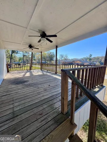 a view of a livingroom with furniture and staircase