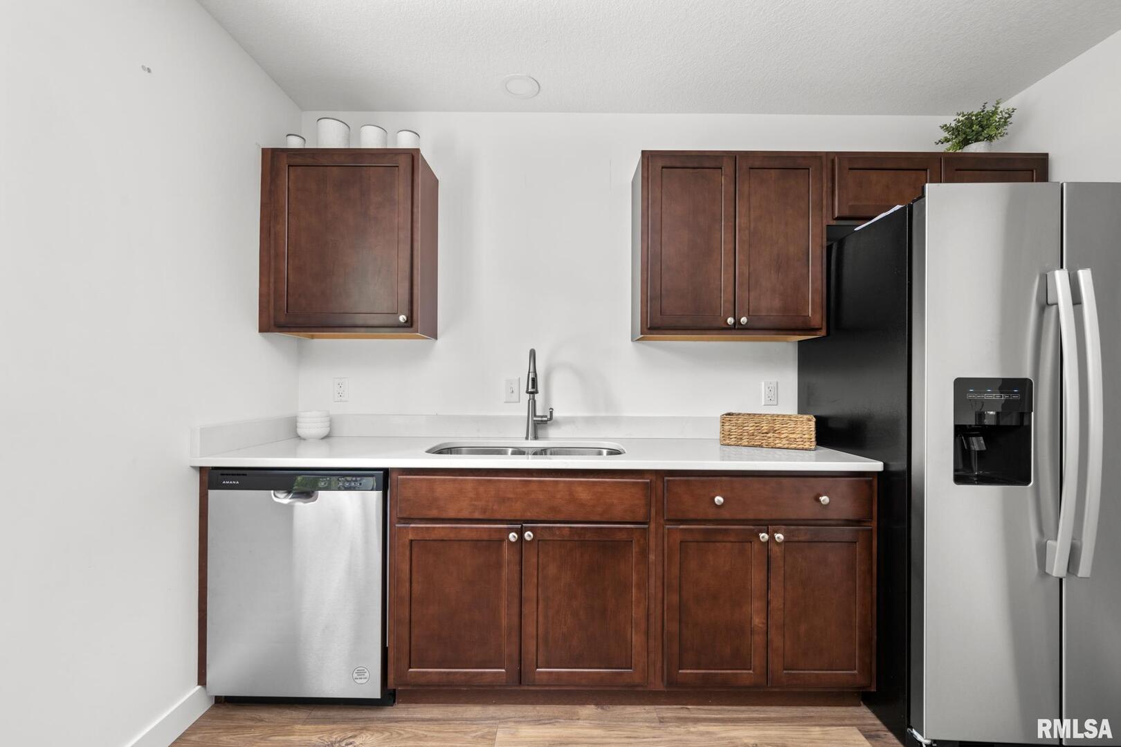 813 Williams Way Carbon Cliff, IL 61239 - Photo 11 of 36 a kitchen with stainless steel appliances granite countertop a refrigerator and a sink