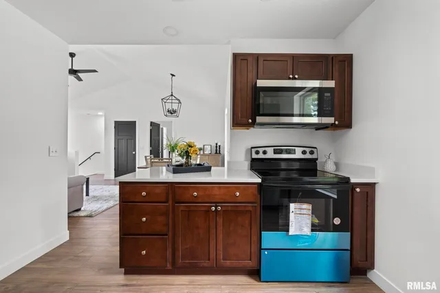 a kitchen with a stove and a microwave