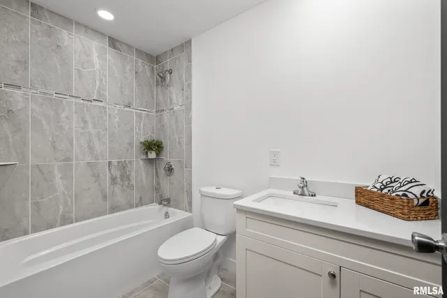 a bathroom with a sink a toilet and a bathtub