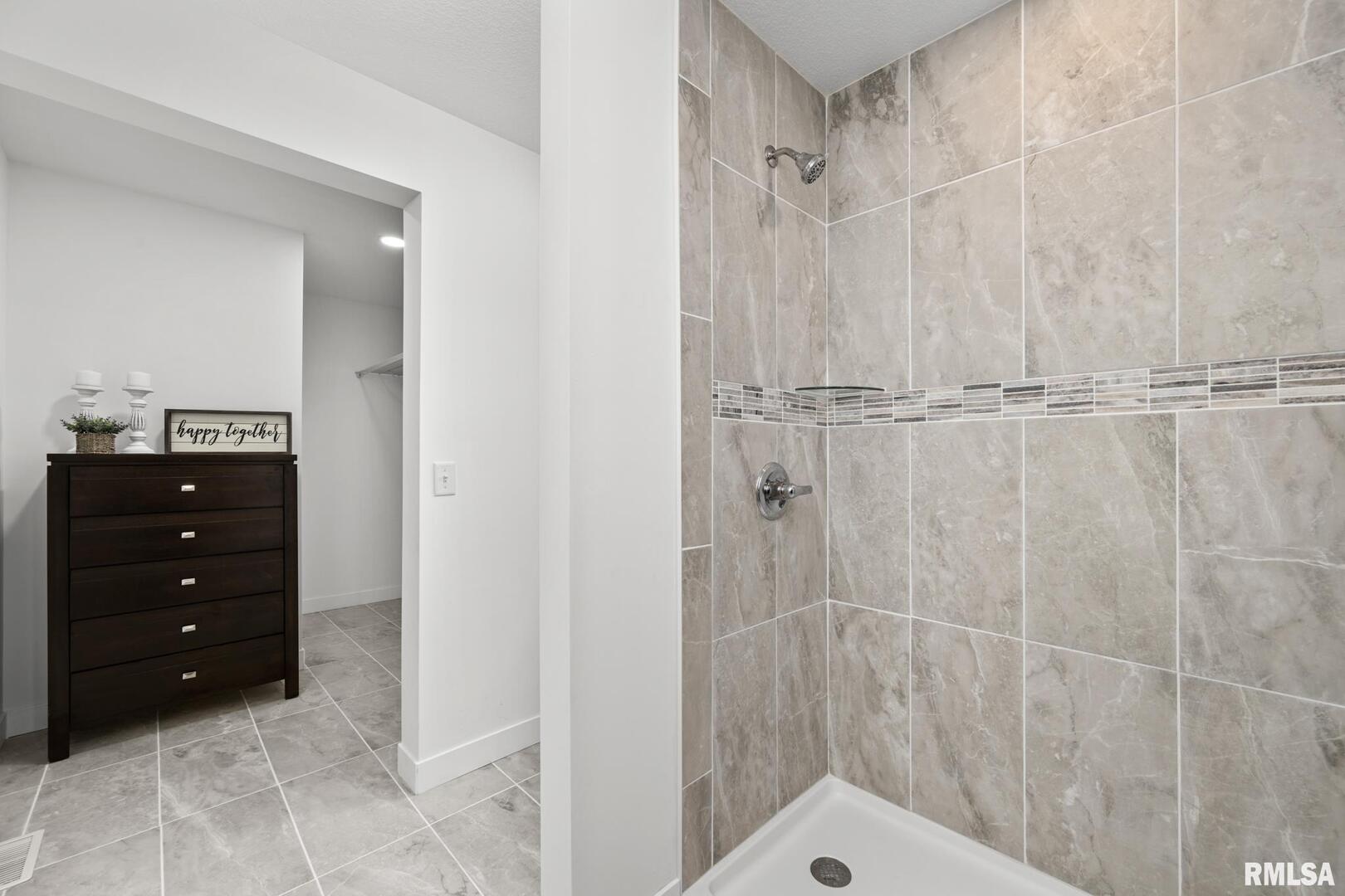 813 Williams Way Carbon Cliff, IL 61239 - Photo 19 of 36 a bathroom with a sink vanity and shower