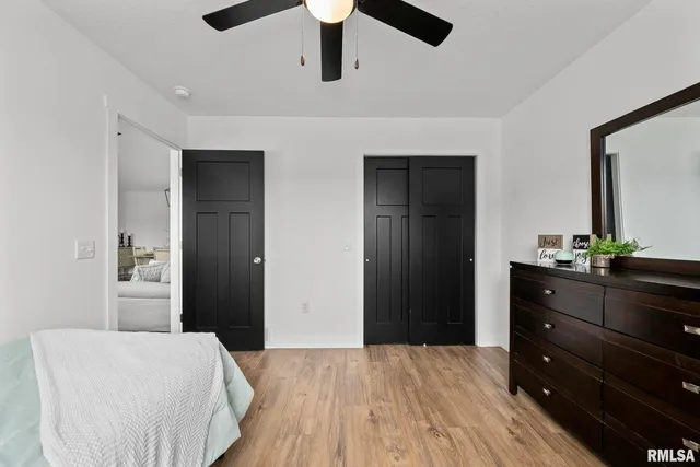 a bedroom with a bed and a dresser