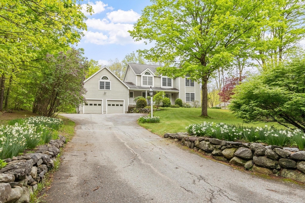 94 Turner Road Townsend, MA 01469 - Photo 38 of 42 a view of a house with a yard and potted plants