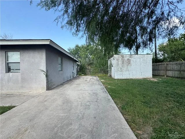 a view of an empty room and a window
