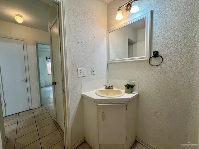 a view of an empty room and fire place