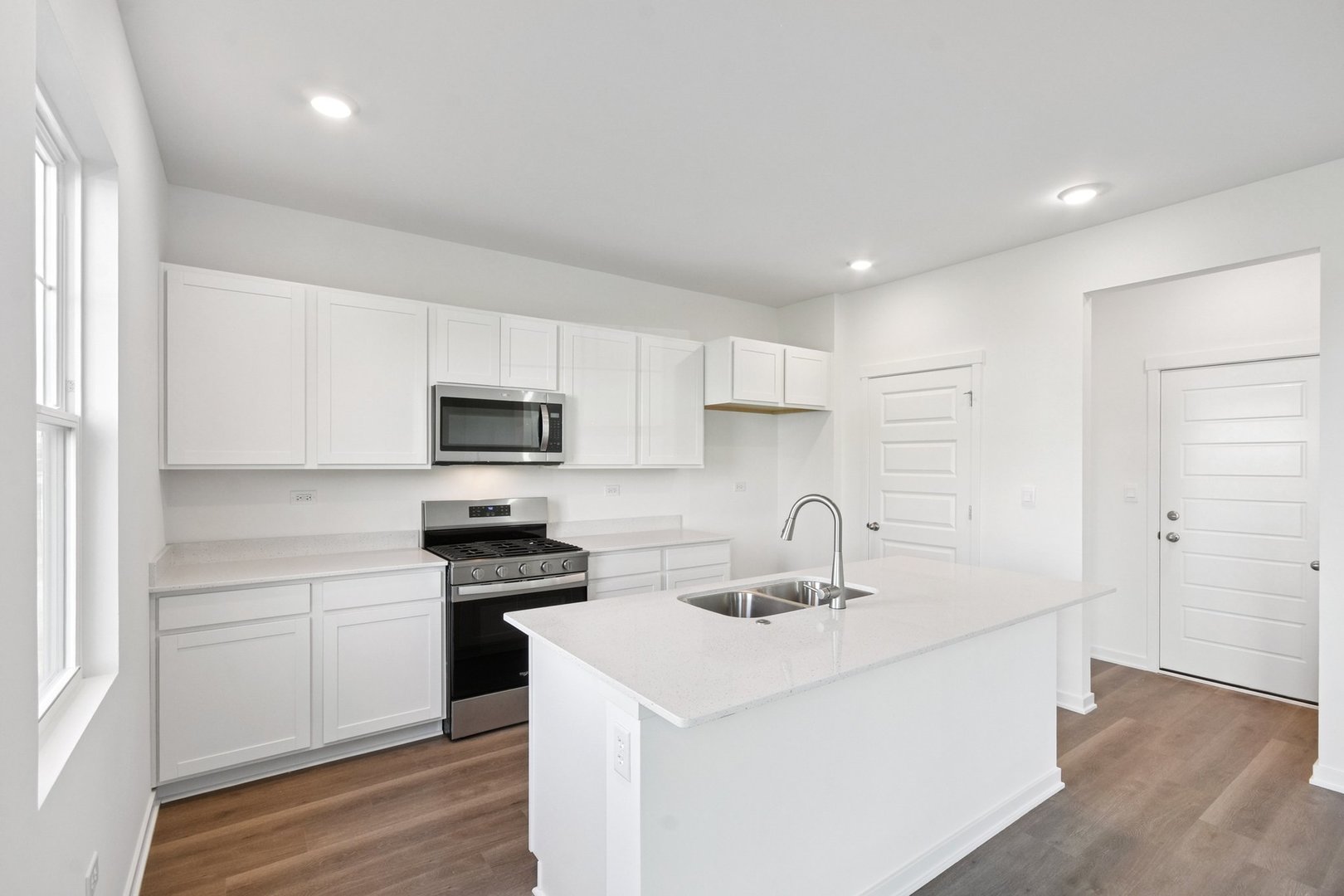 13530 Coronado Circle Plainfield, IL 60544 - Photo 12 of 49 a kitchen with sink a microwave and cabinets