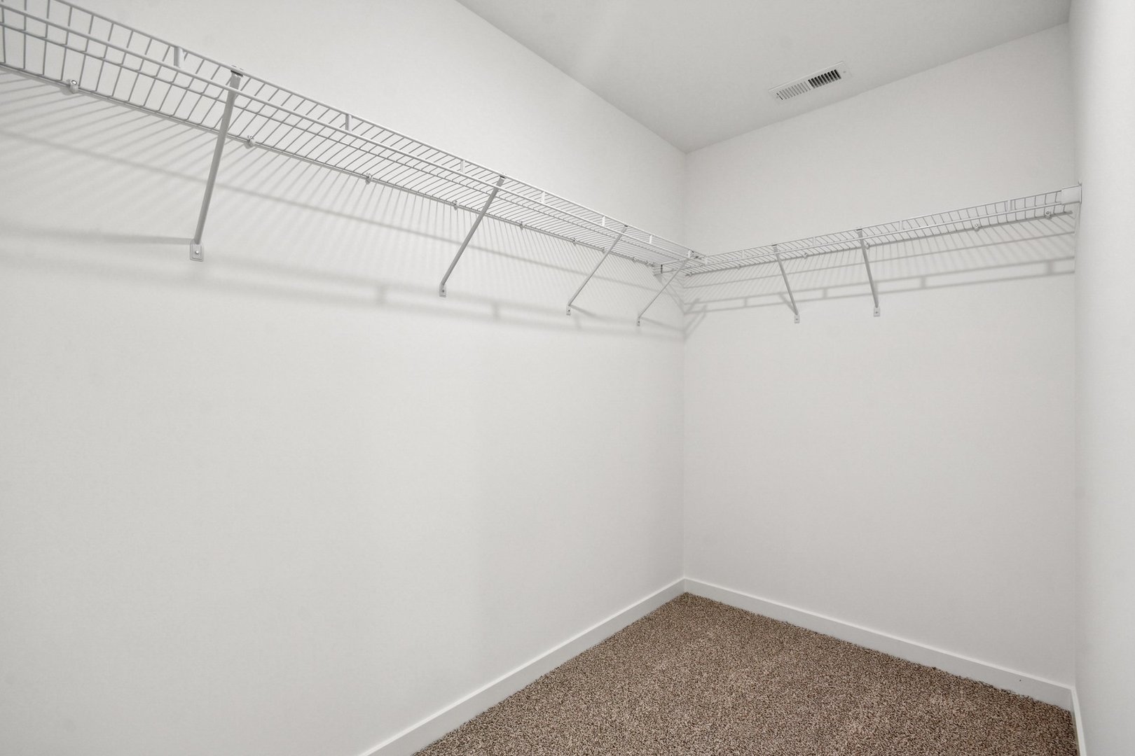 13530 Coronado Circle Plainfield, IL 60544 - Photo 23 of 49 a view of a room with racks on the wall
