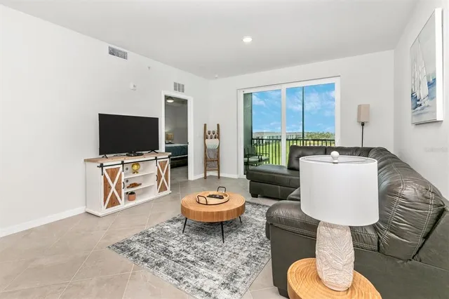 a balcony with table and chairs