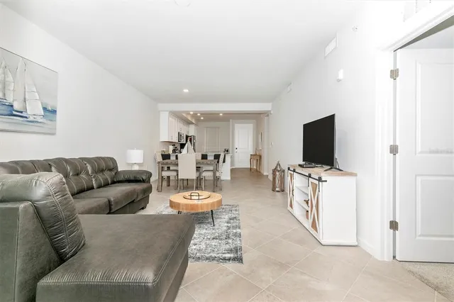 a bedroom with a bed and a television