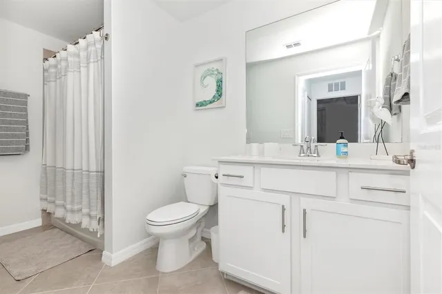 a view of a park with large trees