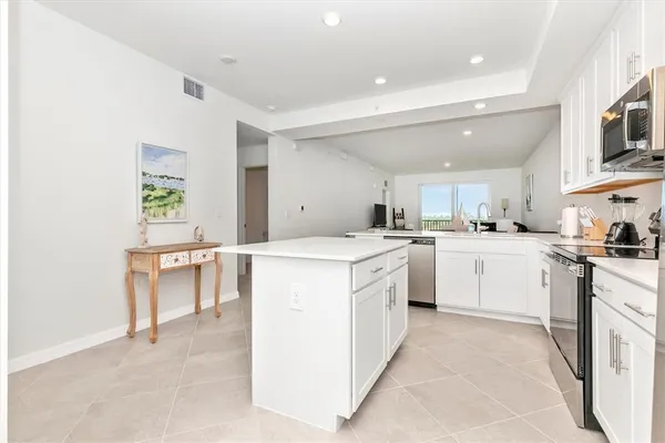 a room with a bed and a cabinets