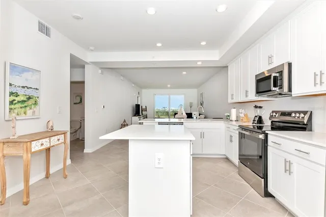 a kitchen with a table and chairs in it