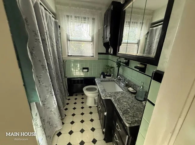 a bathroom with sink and mirror