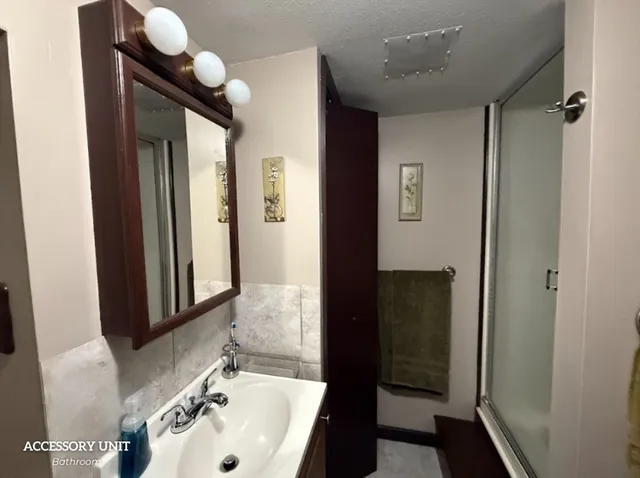 a bathroom with a sink and a mirror