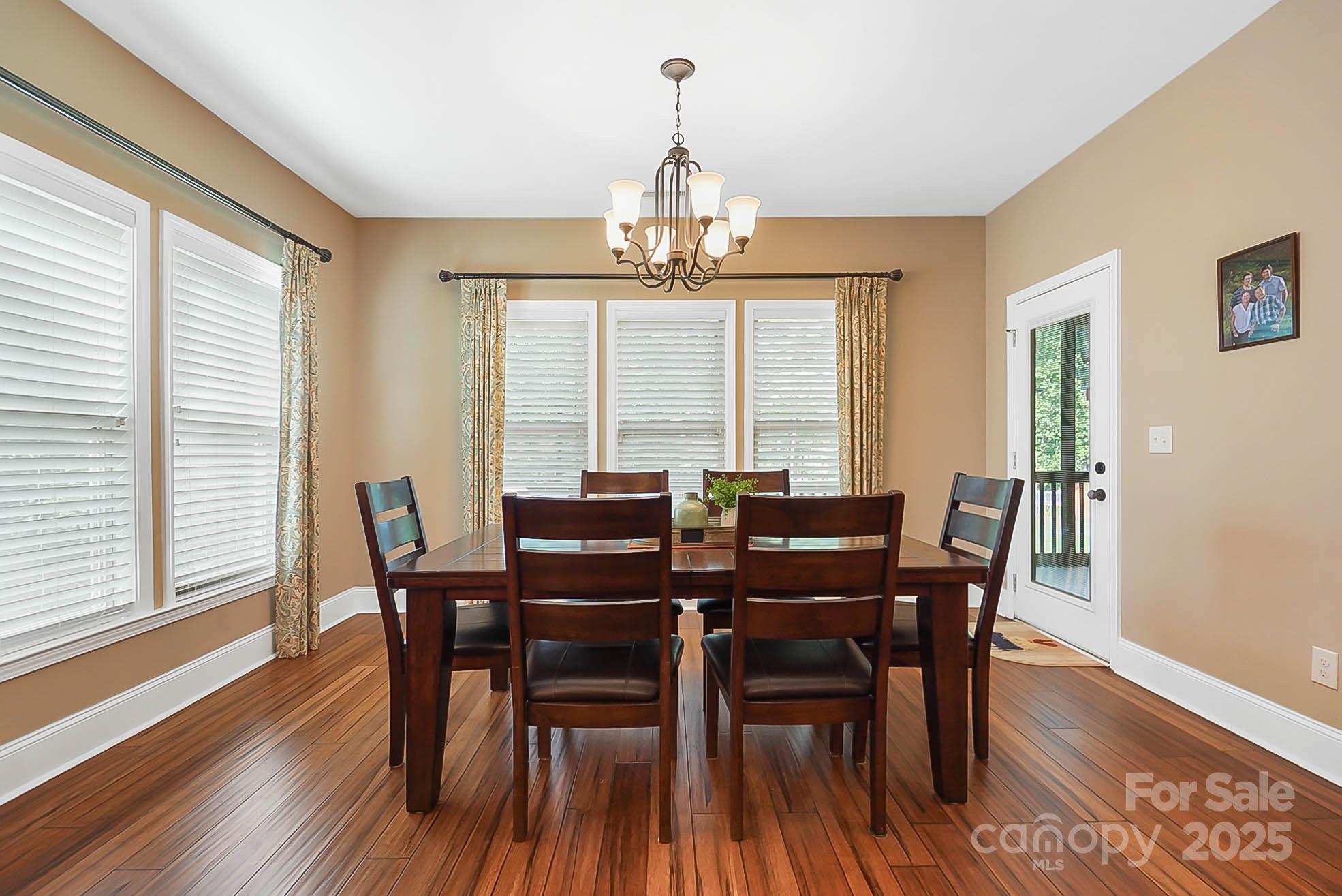 7305 Indian Trail Fairview Road Indian Trail, NC 28079 - Photo 19 of 48 a view of a dining room with furniture window and wooden floor