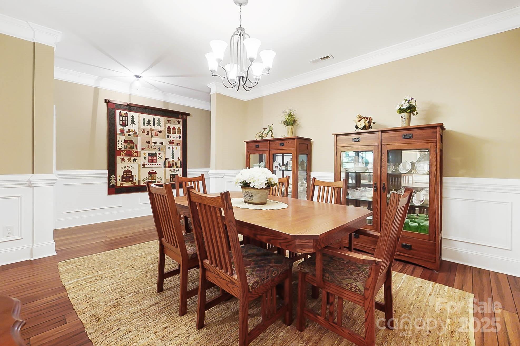 7305 Indian Trail Fairview Road Indian Trail, NC 28079 - Photo 21 of 48 a view of a dining room with furniture window and wooden floor