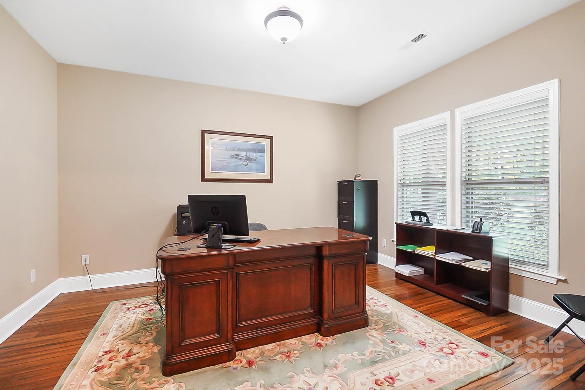 7305 Indian Trail Fairview Road Indian Trail, NC 28079 - Photo 22 of 48 a view of a workspace with furniture and a window