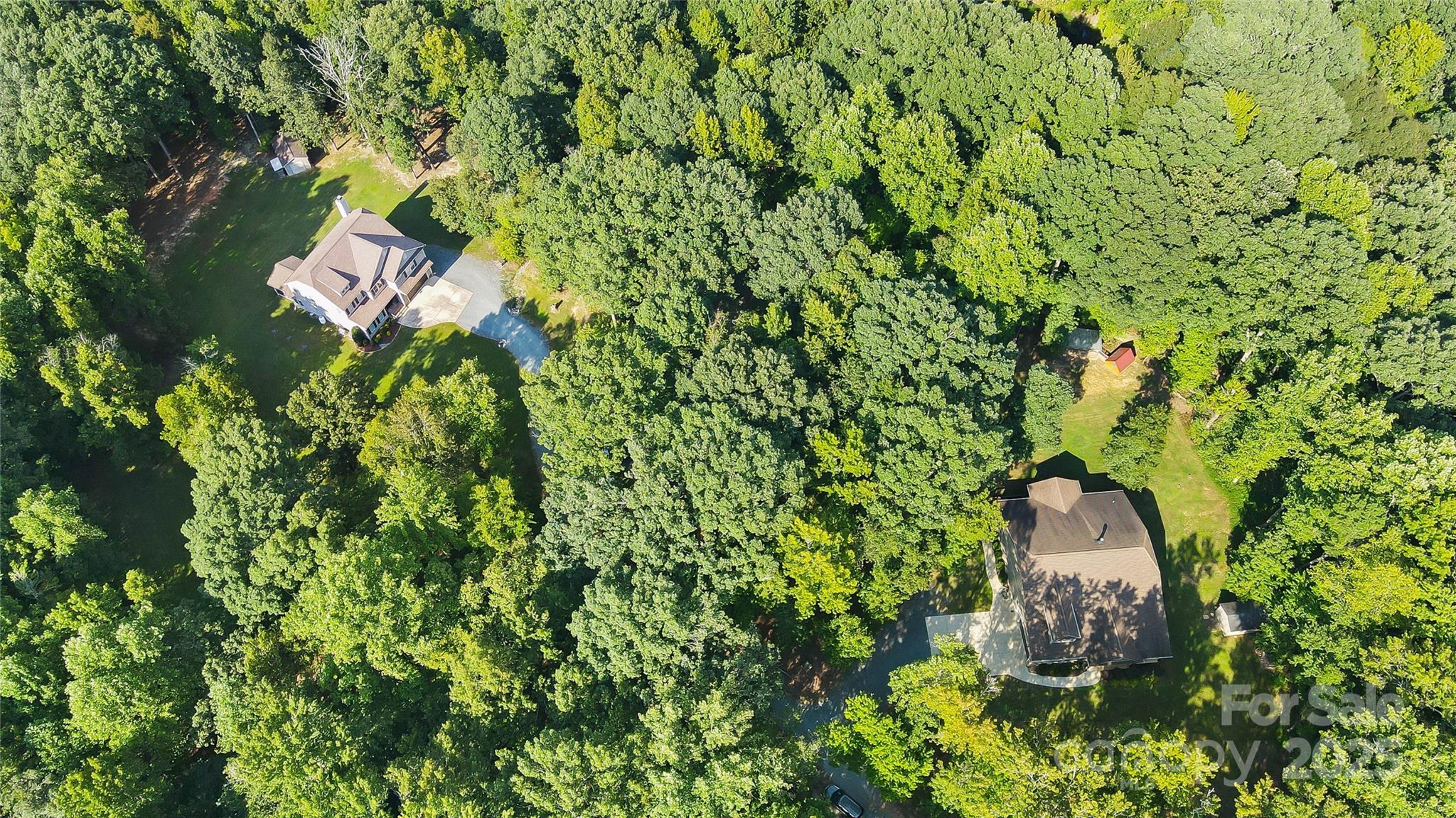 7305 Indian Trail Fairview Road Indian Trail, NC 28079 - Photo 3 of 48 a bird view of a house with a tree in a yard