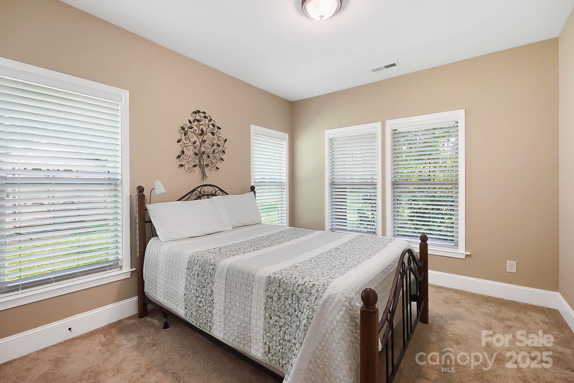 7305 Indian Trail Fairview Road Indian Trail, NC 28079 - Photo 31 of 48 a bedroom with a bed and a window