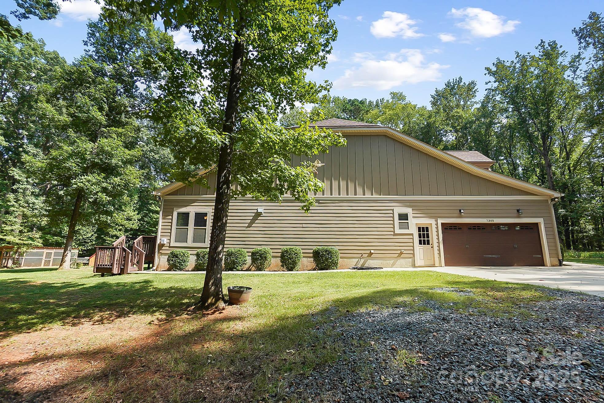 7305 Indian Trail Fairview Road Indian Trail, NC 28079 - Photo 34 of 48 a view of a house with a yard