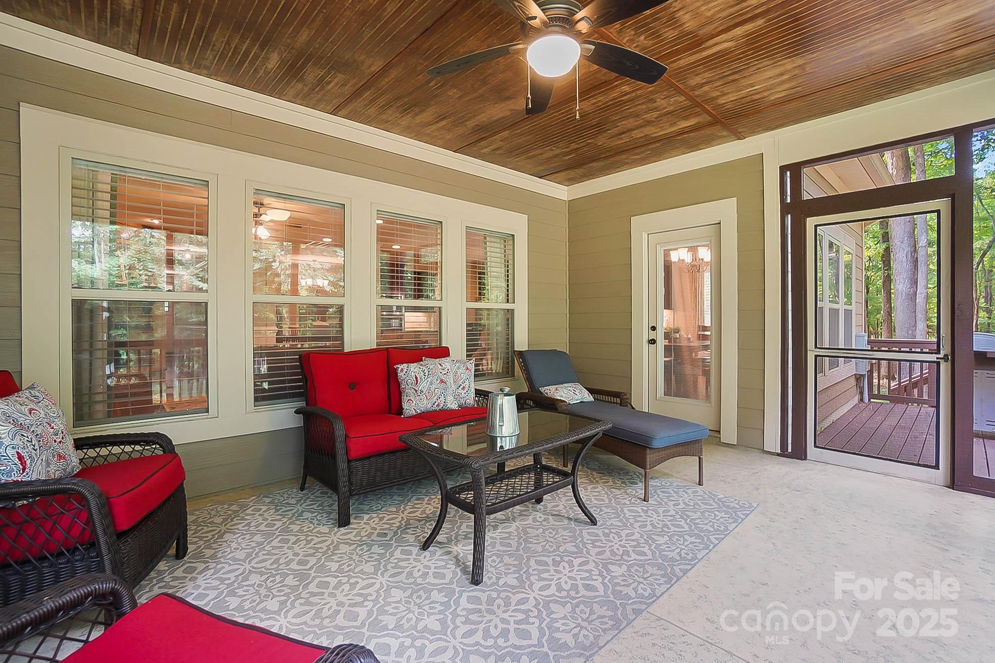 7305 Indian Trail Fairview Road Indian Trail, NC 28079 - Photo 42 of 48 a living room with furniture a rug and a chandelier