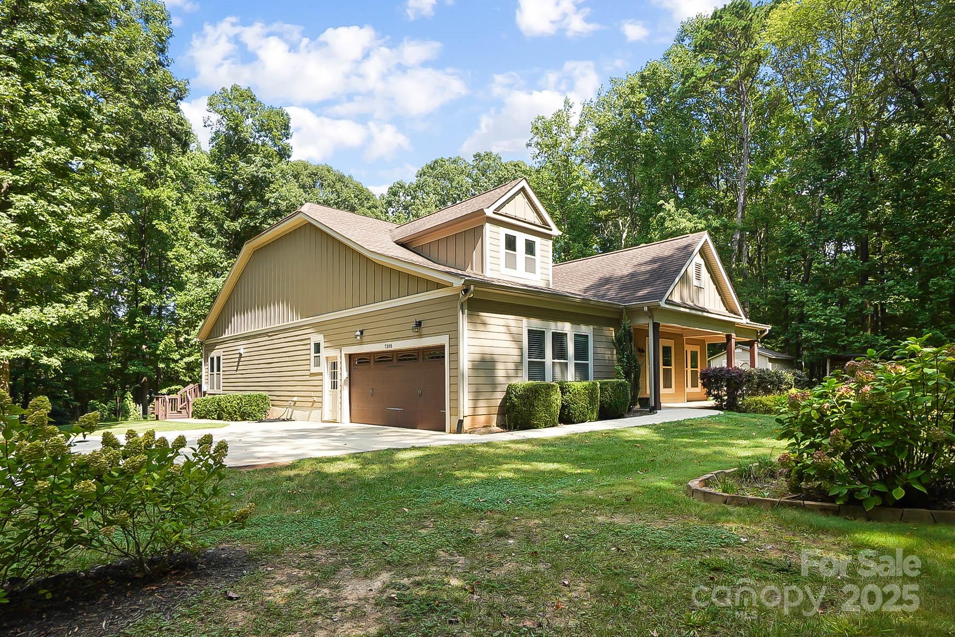 7305 Indian Trail Fairview Road Indian Trail, NC 28079 - Photo 45 of 48 a front view of house with yard and green space
