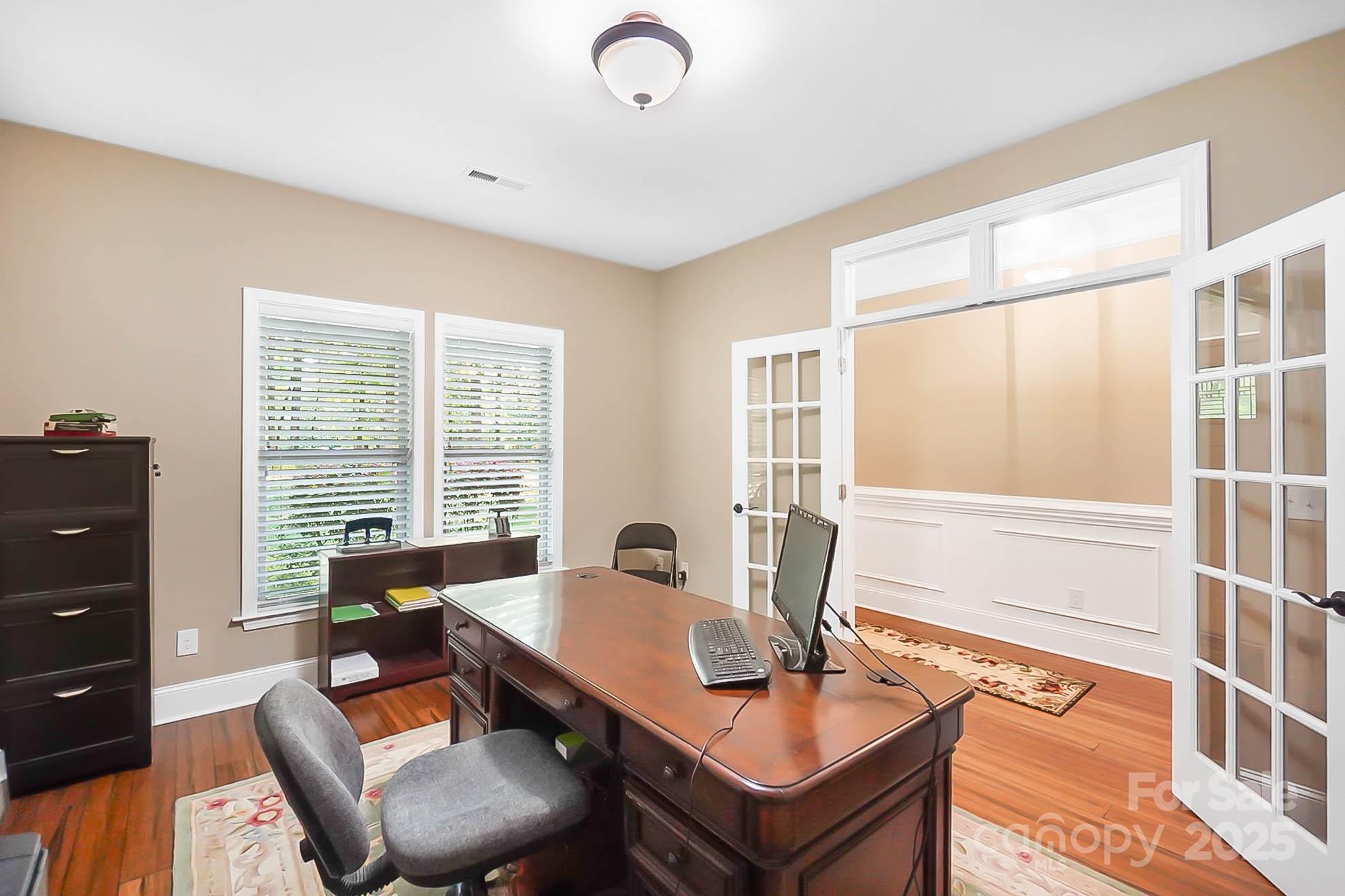 7305 Indian Trail Fairview Road Indian Trail, NC 28079 - Photo 8 of 48 a view of a workspace with furniture and a window
