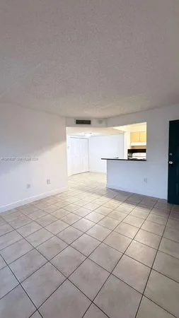 a view of a livingroom with a dishwasher and a microwave oven