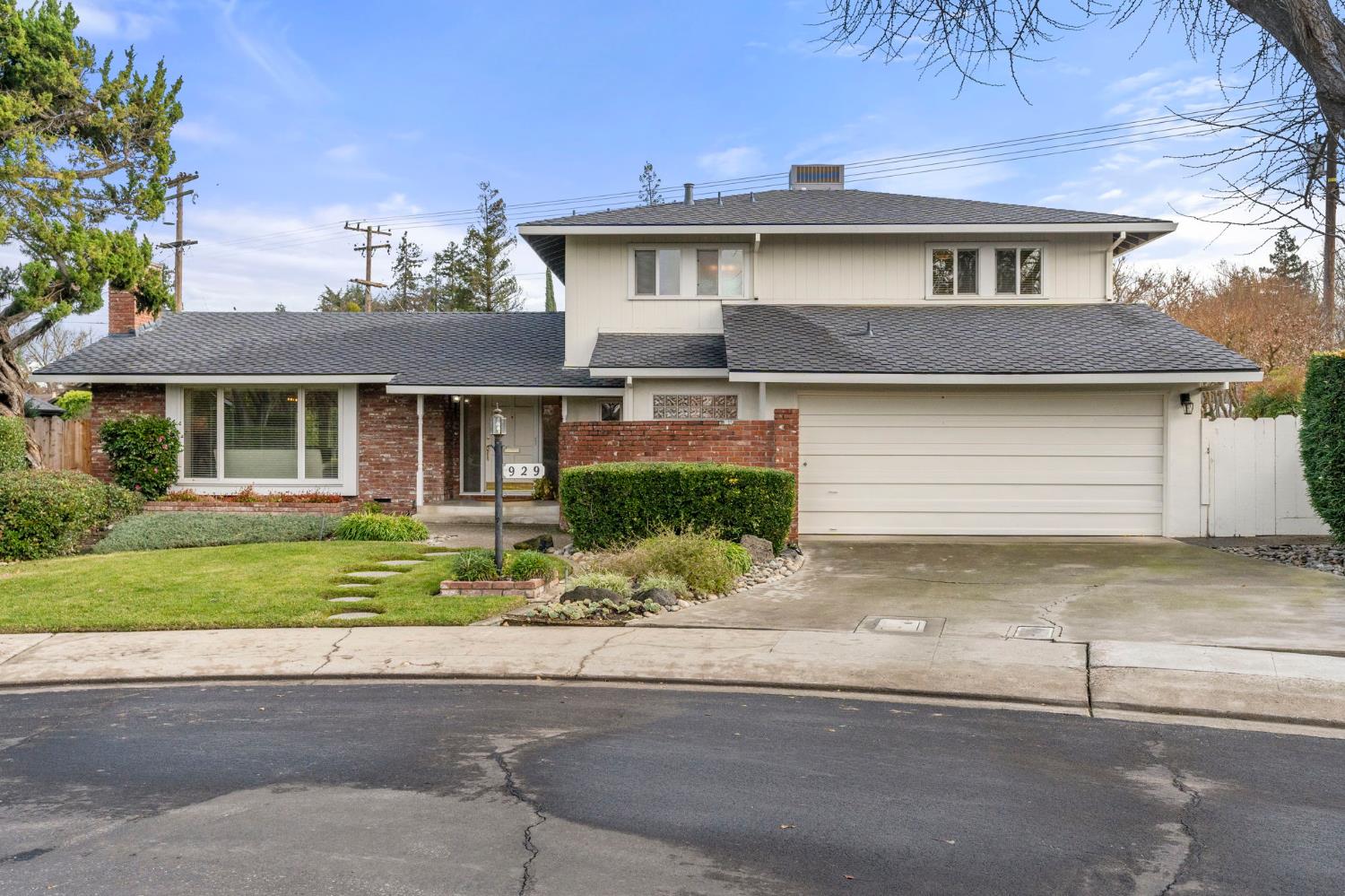 929 Terrace Place Modesto, CA 95350 - Photo 1 of 35 a front view of a house with a yard