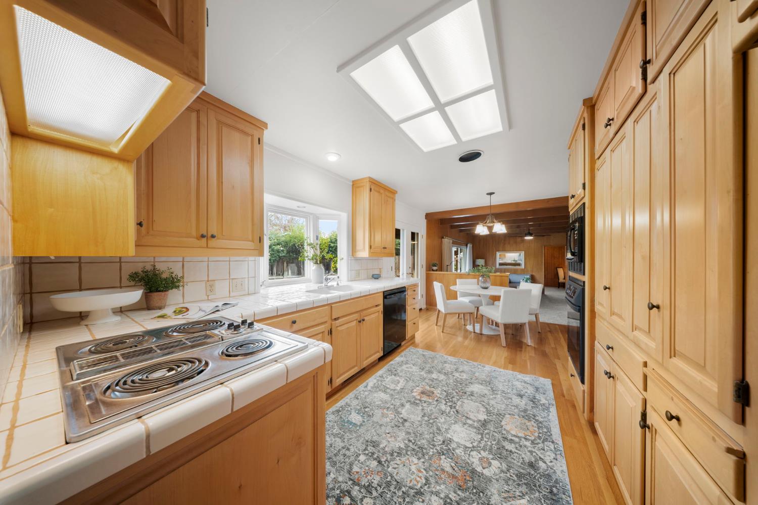 929 Terrace Place Modesto, CA 95350 - Photo 14 of 35 a kitchen with a stove a sink and a refrigerator