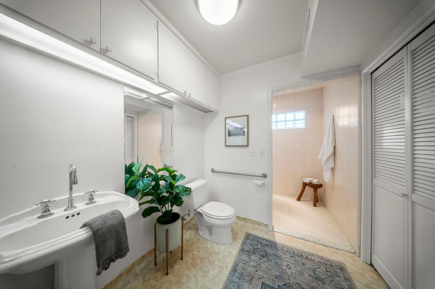 929 Terrace Place Modesto, CA 95350 - Photo 19 of 35 a bathroom with a sink a toilet and a mirror