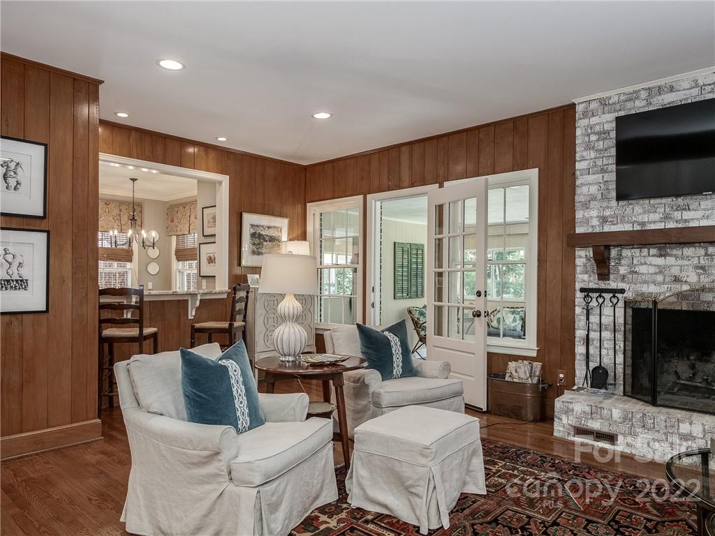 2701 Sharon Road Charlotte, NC 28211 - Photo 11 of 40 a living room with fireplace furniture and a flat screen tv