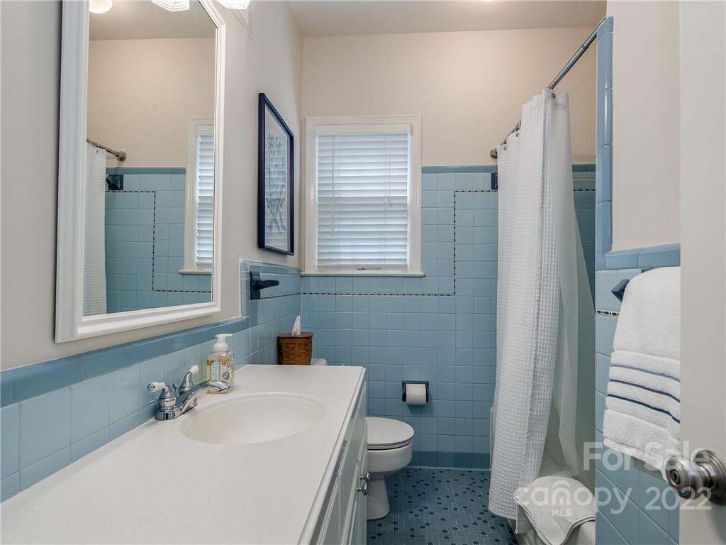 2701 Sharon Road Charlotte, NC 28211 - Photo 18 of 40 a bathroom with a sink toilet and shower
