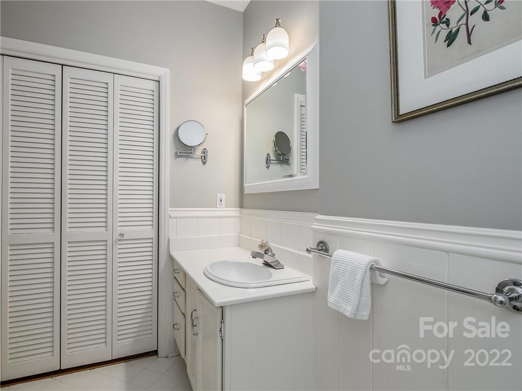 2701 Sharon Road Charlotte, NC 28211 - Photo 20 of 40 a bathroom with a sink and a mirror