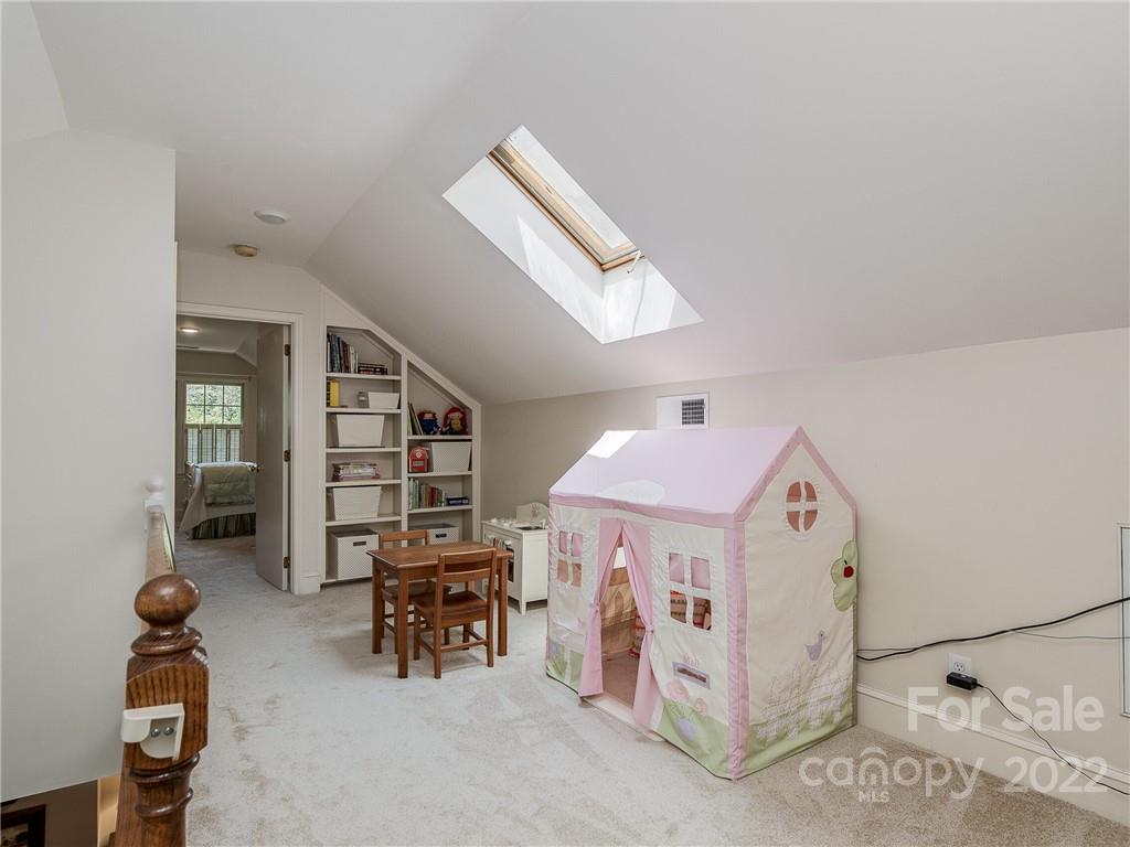 2701 Sharon Road Charlotte, NC 28211 - Photo 25 of 40 a bedroom with furniture and a large window