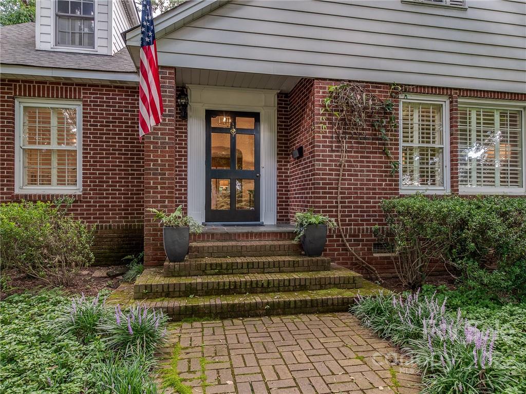 2701 Sharon Road Charlotte, NC 28211 - Photo 3 of 40 a front view of a house with a garden