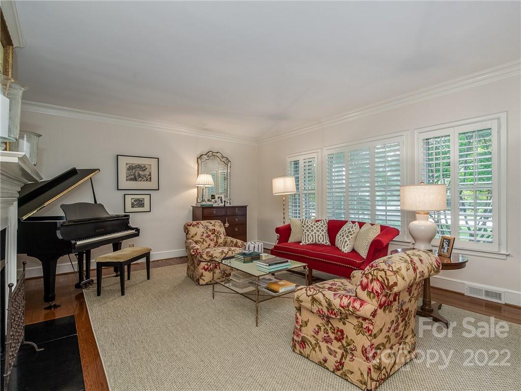 2701 Sharon Road Charlotte, NC 28211 - Photo 6 of 40 a living room with furniture rug and wooden floor