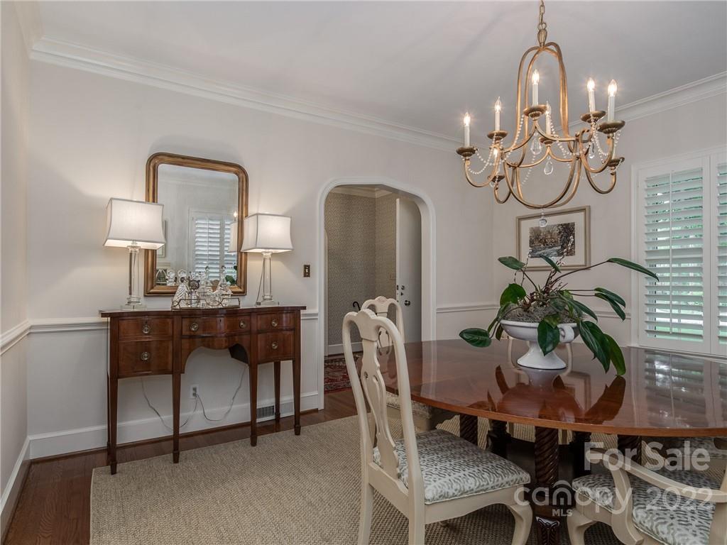 2701 Sharon Road Charlotte, NC 28211 - Photo 8 of 40 a view of a dining room with furniture and chandelier