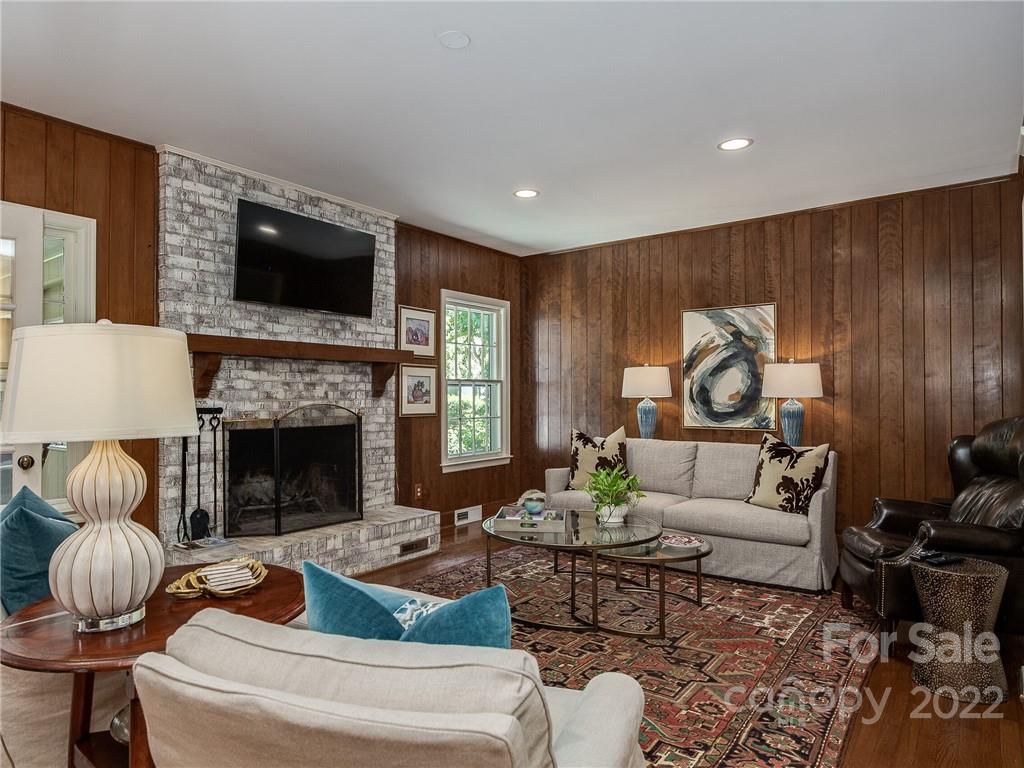 2701 Sharon Road Charlotte, NC 28211 - Photo 10 of 40 a living room with furniture and a fireplace
