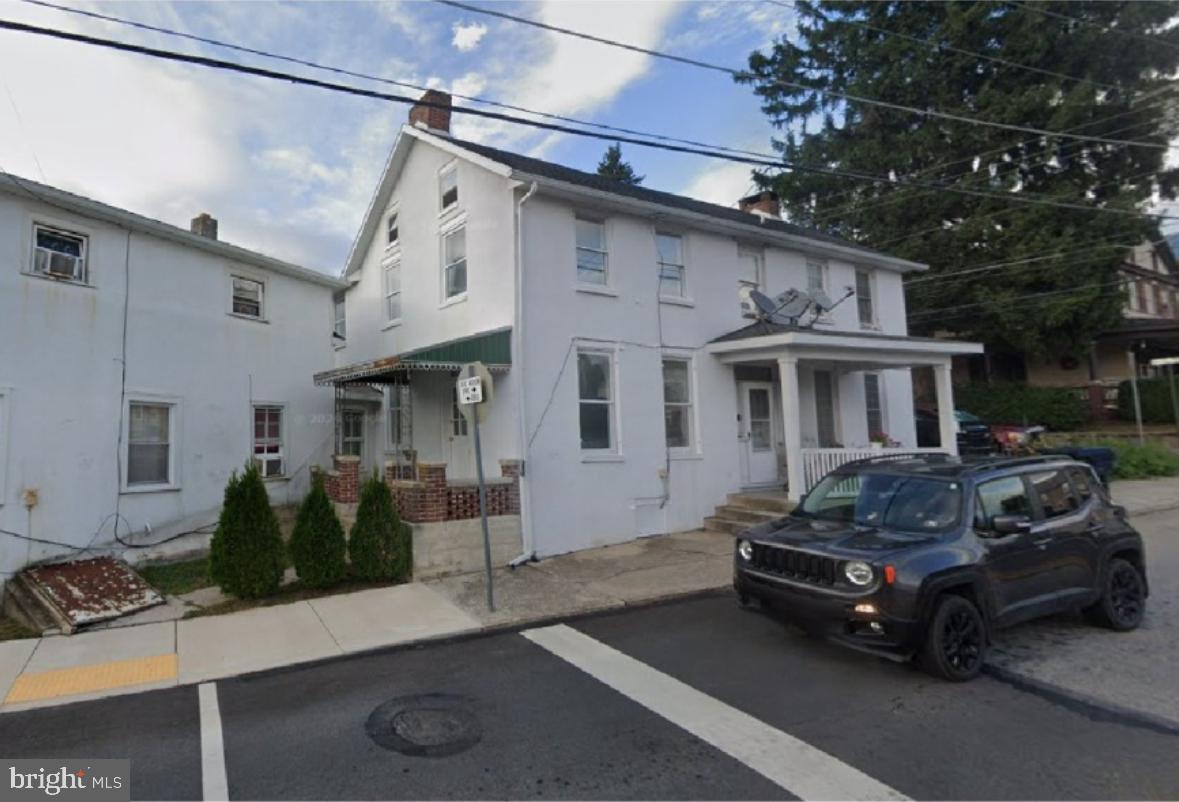 103 Rampike Hill Road Bendersville, PA 17304 - Photo 3 of 22 a car parked in front of a white house