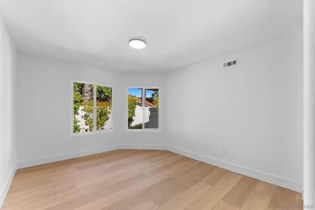 an empty room with windows