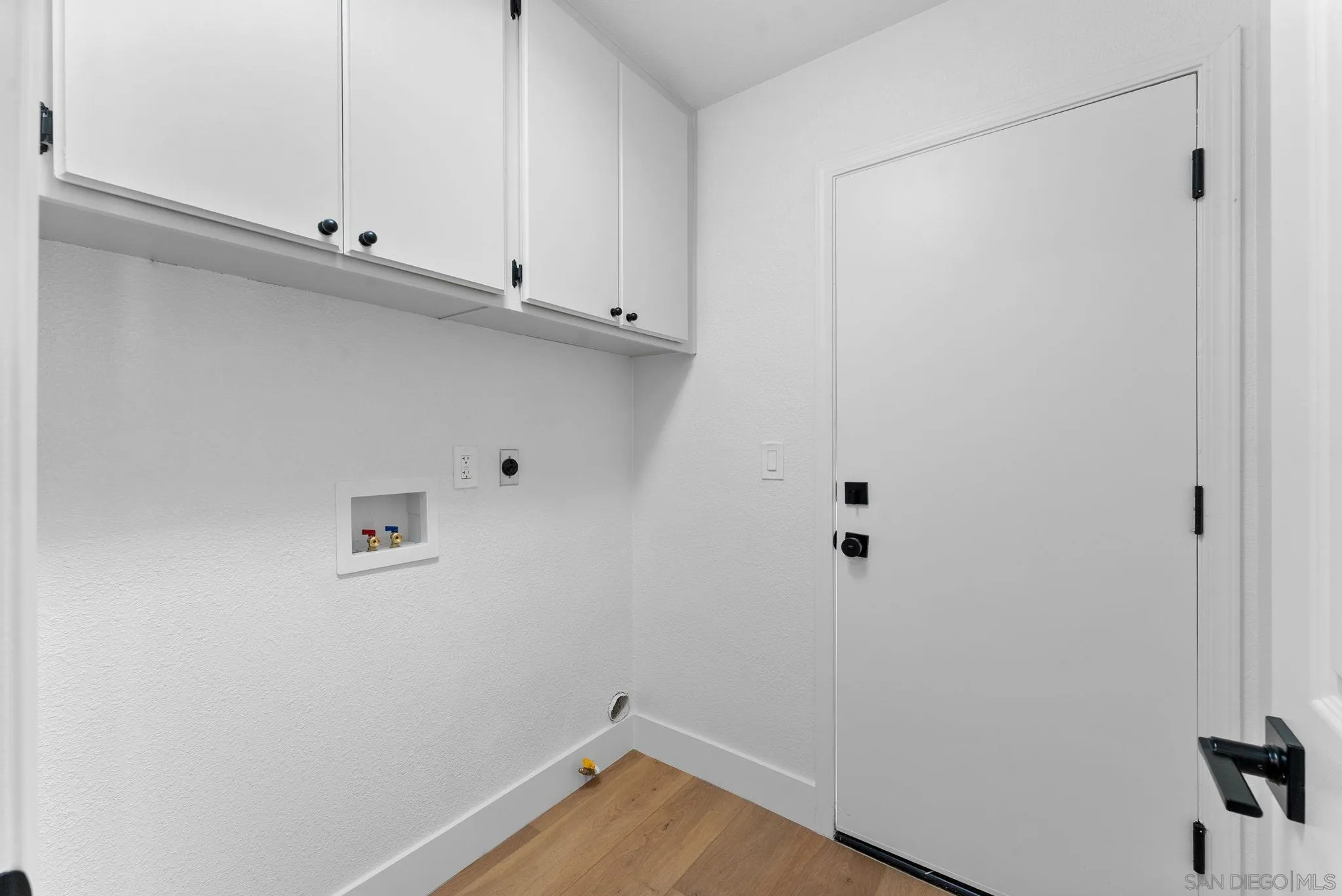 4946 Alicante Way Oceanside, CA 92056 - Photo 19 of 34 a view of small space with wooden floor