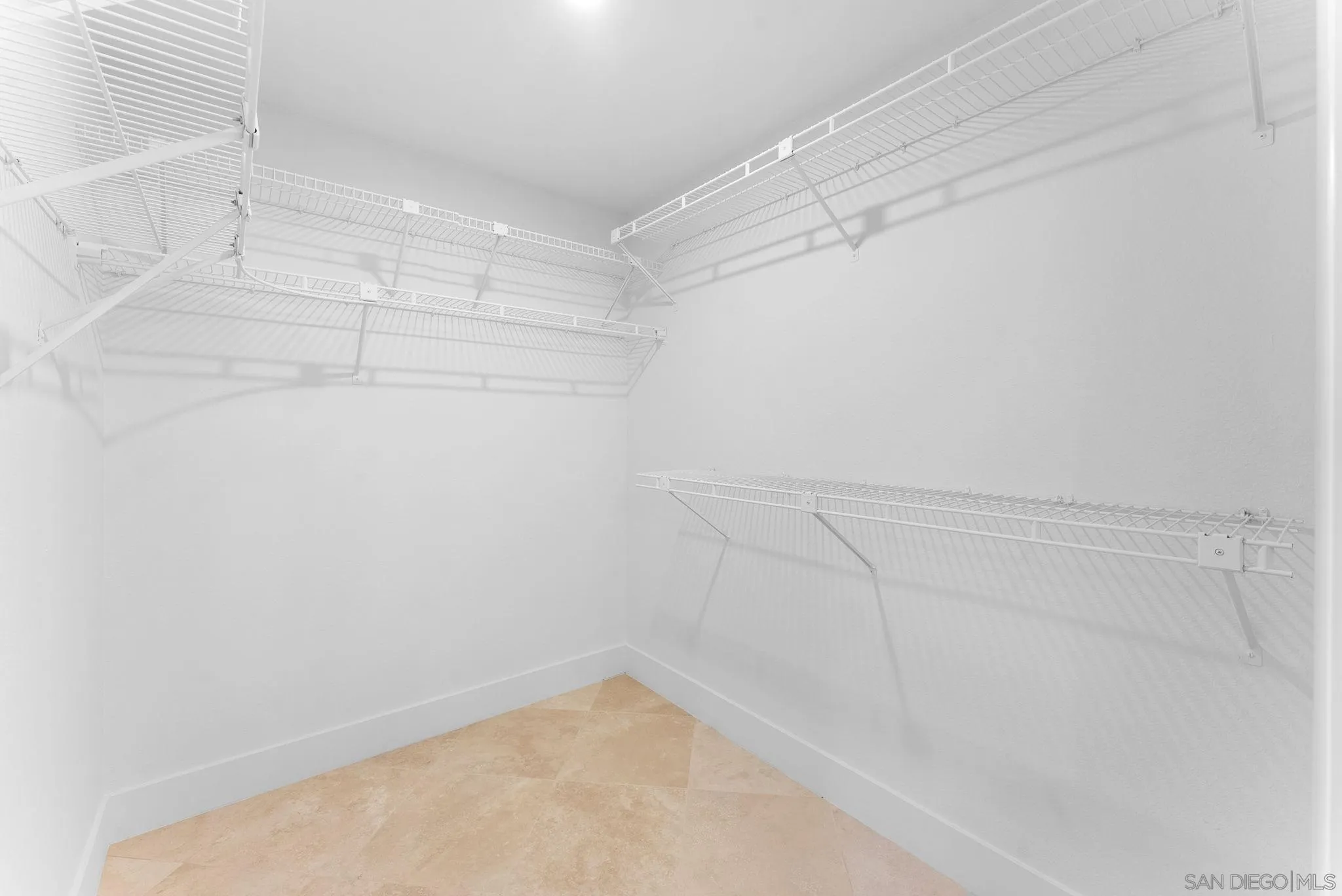 4946 Alicante Way Oceanside, CA 92056 - Photo 23 of 34 a view of a room with racks on the wall