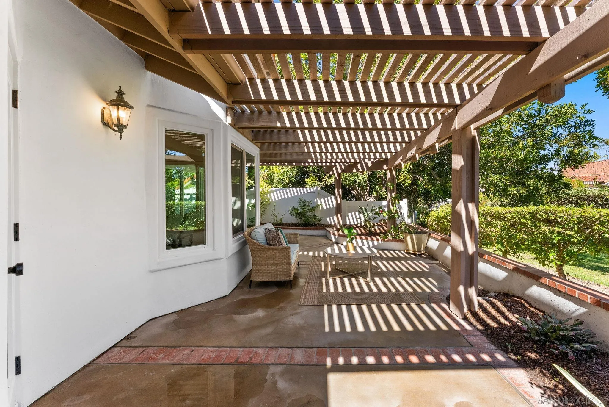 4946 Alicante Way Oceanside, CA 92056 - Photo 28 of 34 a view of a porch with furniture