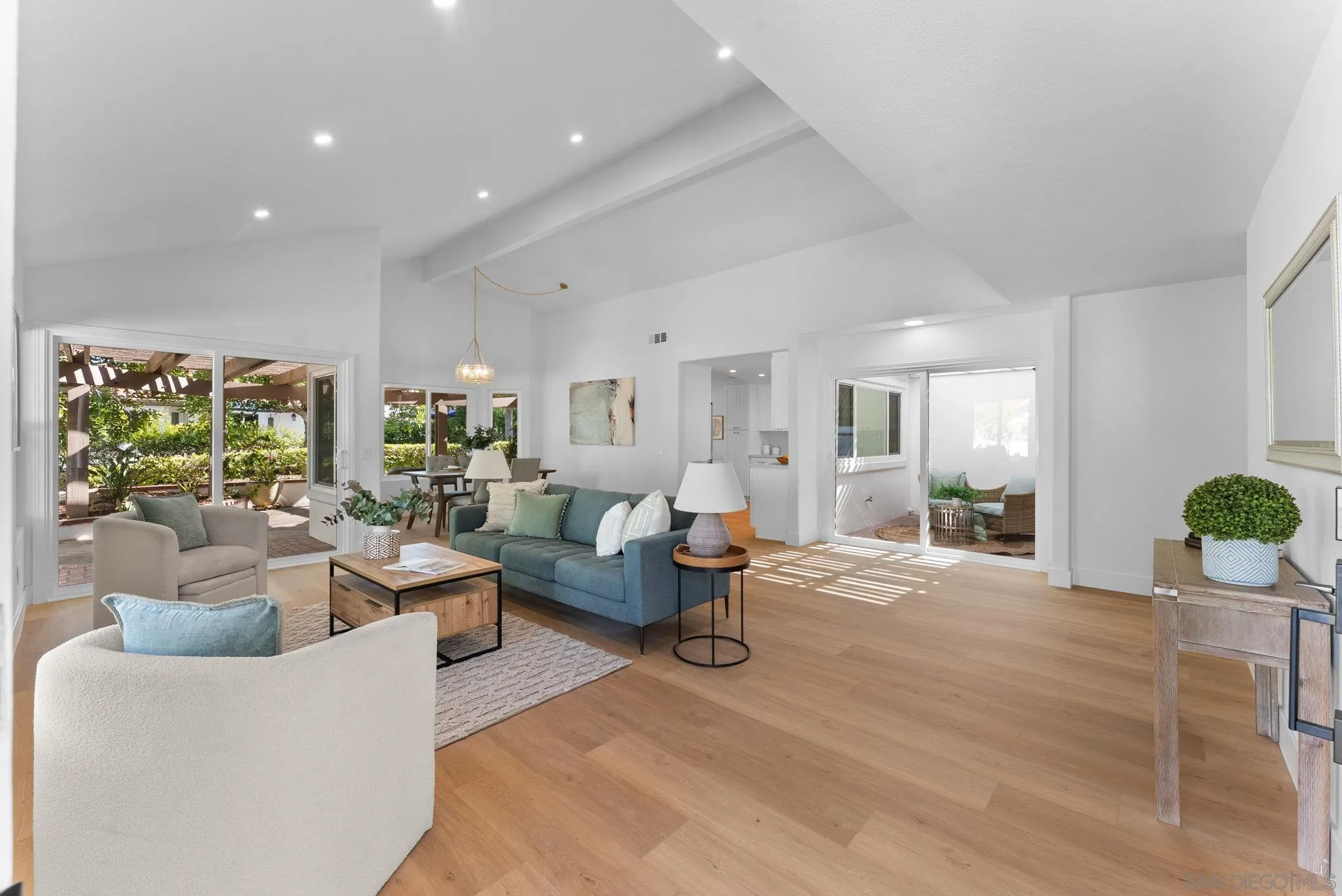 4946 Alicante Way Oceanside, CA 92056 - Photo 4 of 34 a living room with furniture and wooden floor