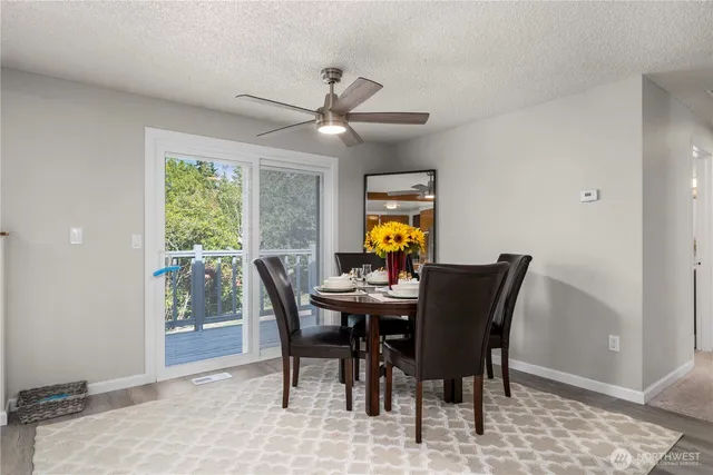 a view of a dining room with furniture and a window