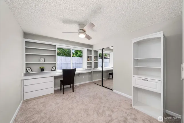 a workspace with furniture and window